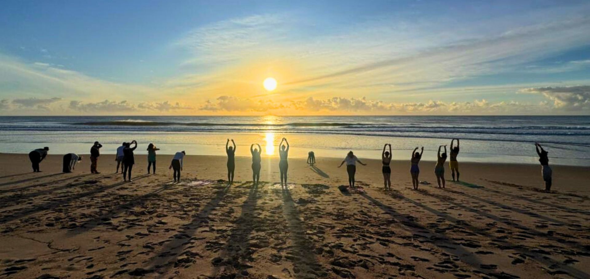 wellness retreats brazil - Yoga in the beach | Unah Piracanga Bahia